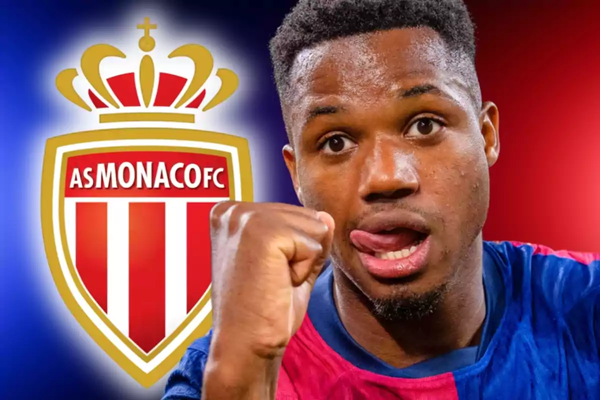 Soccer player celebrating with the AS Monaco FC crest in the background