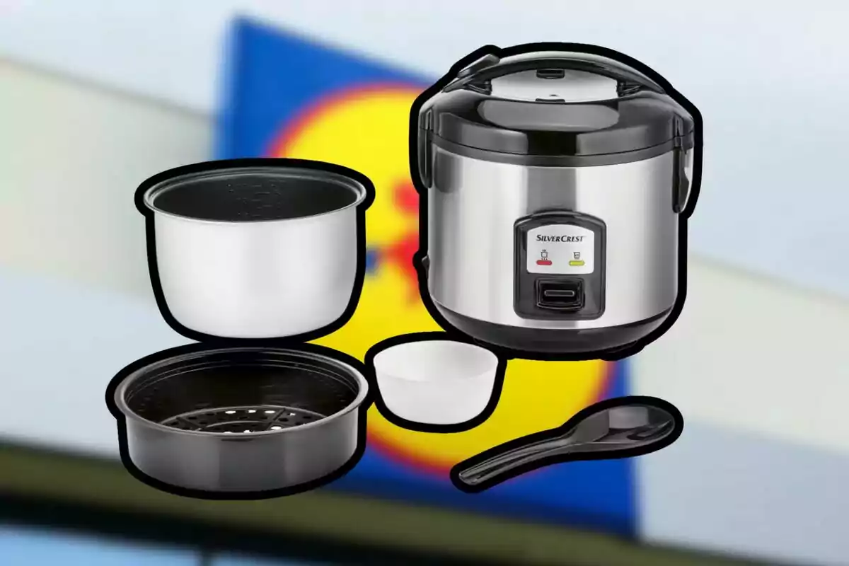 Electric rice cooker with accessories against a blurred background of a supermarket sign Electric rice cooker with accessories against a blurred background of a supermarket sign