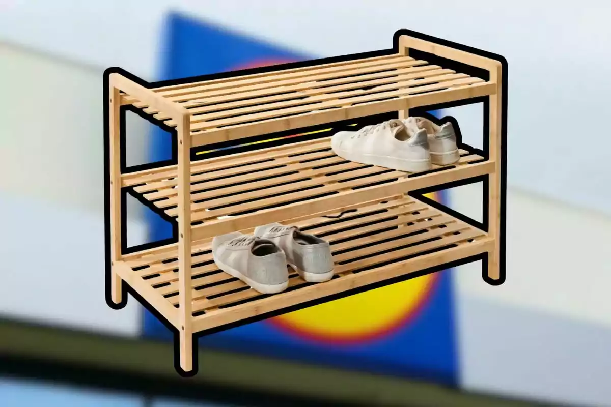 Two-tier wooden shoe rack with a pair of white shoes and another pair of gray shoes against a blurred background Two-tier wooden shoe rack with a pair of white shoes and another pair of gray shoes against a blurred background