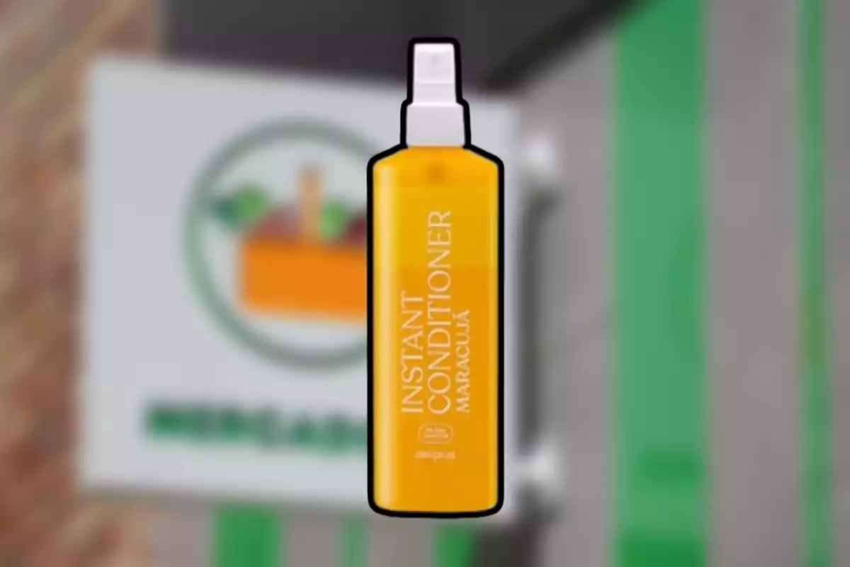 Yellow bottle of instant passion fruit conditioner with spray nozzle against a blurred background