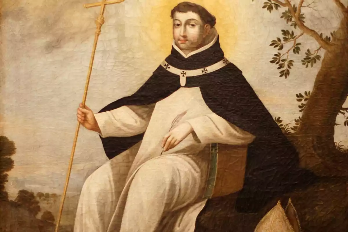 Pintura d’un monjo amb hàbit blanc i capa negra assegut sota un arbre sostenint un bàcul daurat Pintura d’un monjo amb hàbit blanc i capa negra assegut sota un arbre sostenint un bàcul daurat