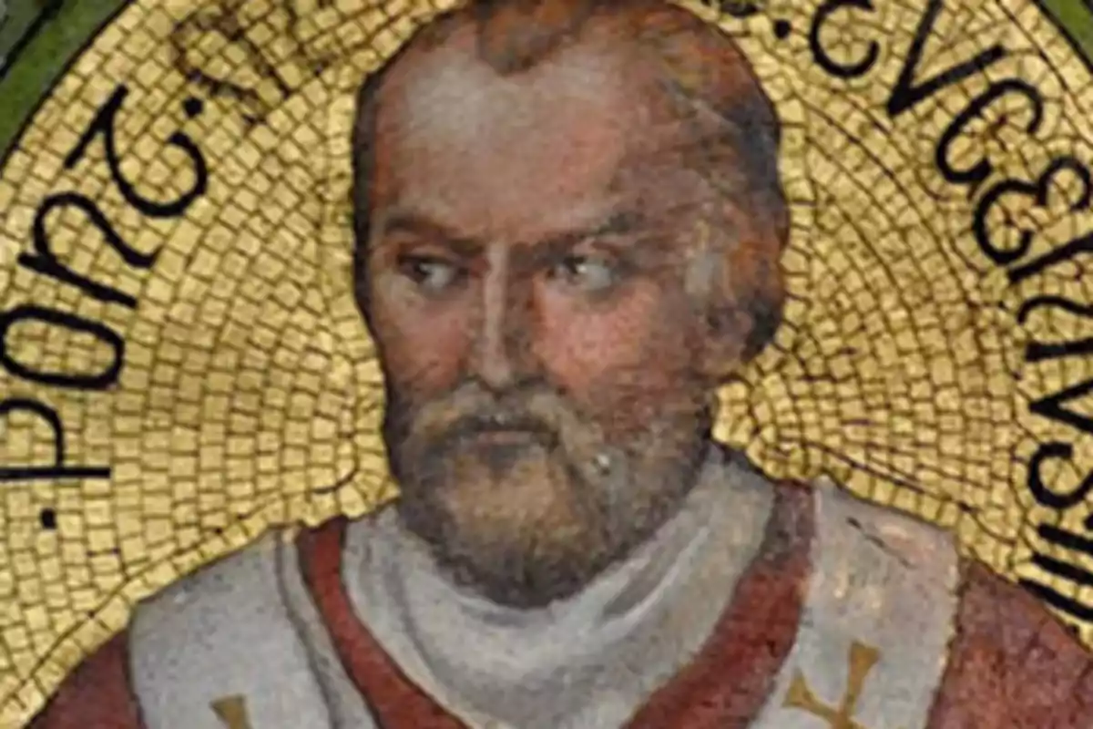 Retrat antic d’un home amb barba i vestimenta religiosa sobre un fons daurat amb lletres negres Retrat antic d’un home amb barba i vestimenta religiosa sobre un fons daurat amb lletres negres