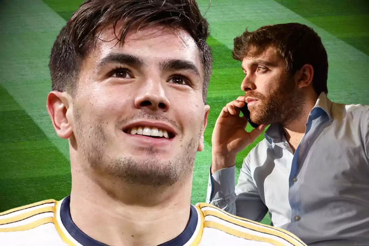 A smiling player in the foreground and a man talking on the phone in the background on a soccer field