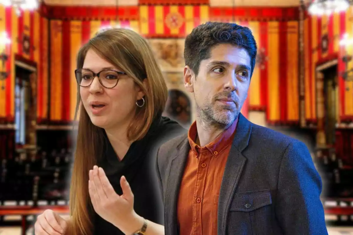 A woman with glasses and a man in a jacket pose in a room decorated with red and yellow curtains.