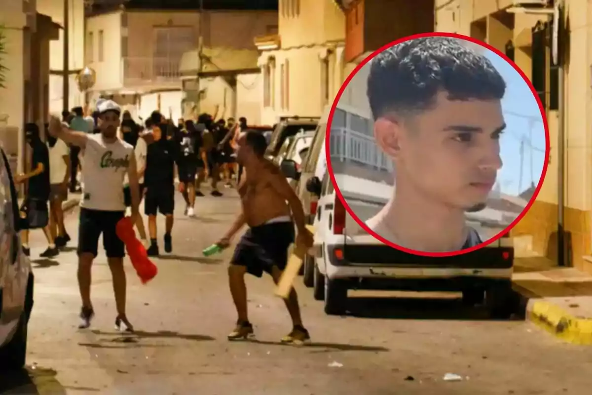 A group of people is on a street at night; some of them appear to be taking part in riots, while in the upper right corner there is a box with the face of a young man watching seriously.
