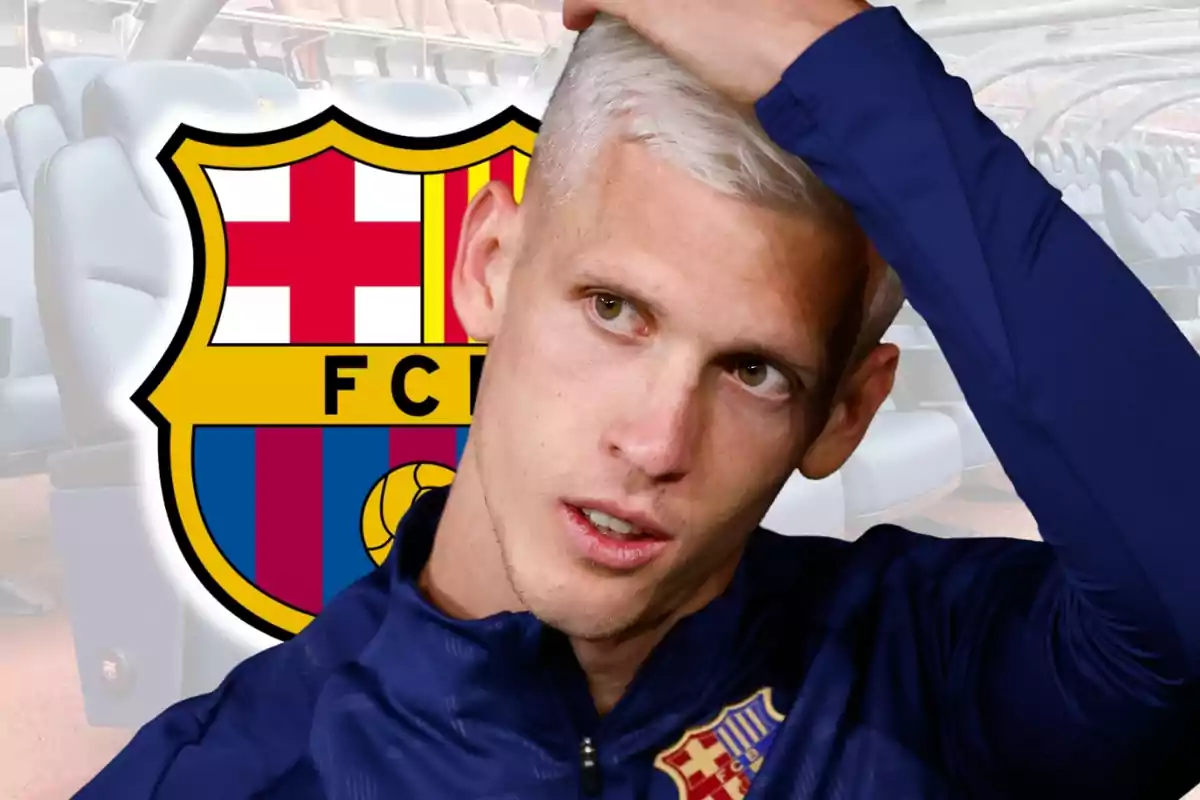 Blond player in a Barcelona uniform touching his head in front of the club’s crest and stadium seats in the background