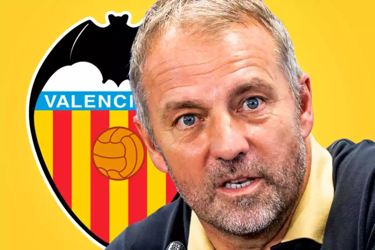 Short-haired, bearded man speaking in front of the Valencia CF crest against a yellow background