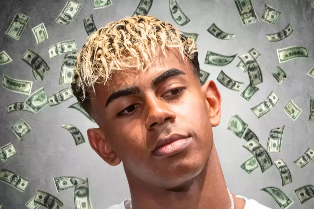 Young man with curly hair and blonde tips, wearing a serious expression as dollar bills fall around him