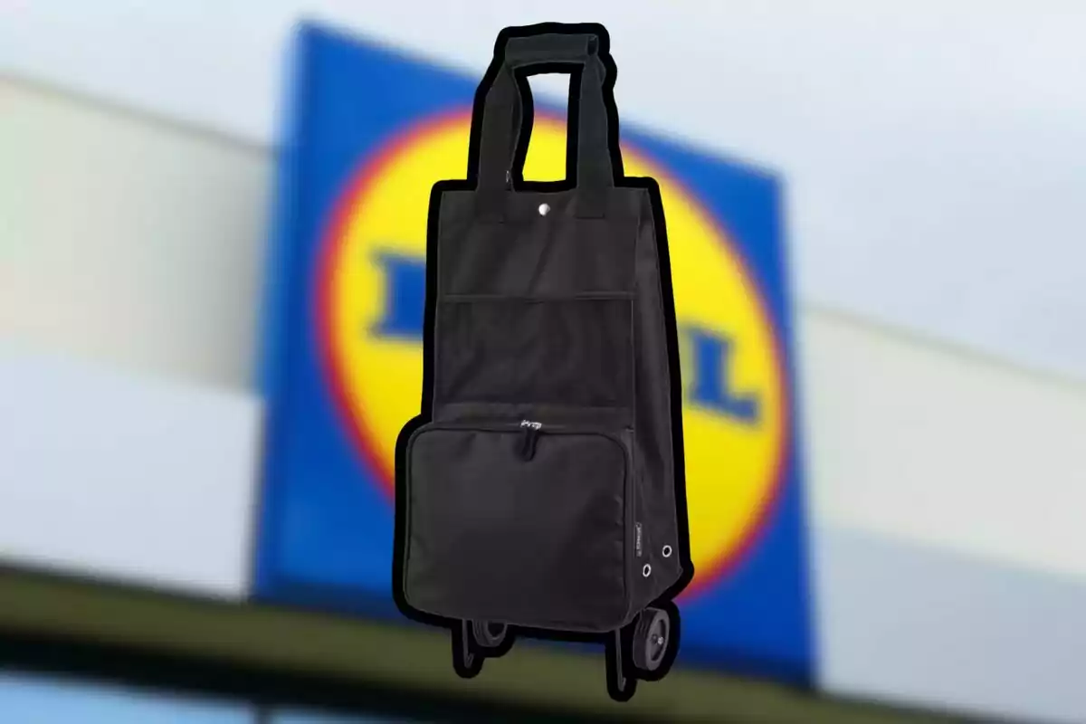 Black shopping cart with wheels in front of a blurry supermarket sign Black shopping cart with wheels in front of a blurry supermarket sign