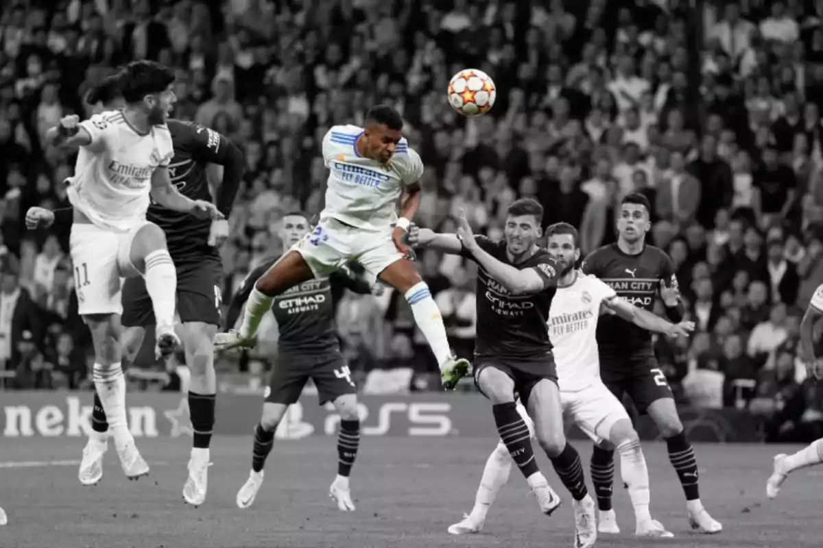 A player jumps to head the ball during an important match while other players surround him, and the background is in black and white except for the player and the ball, which are in color. A player jumps to head the ball during an important match while other players surround him, and the background is in black and white except for the player and the ball, which are in color.