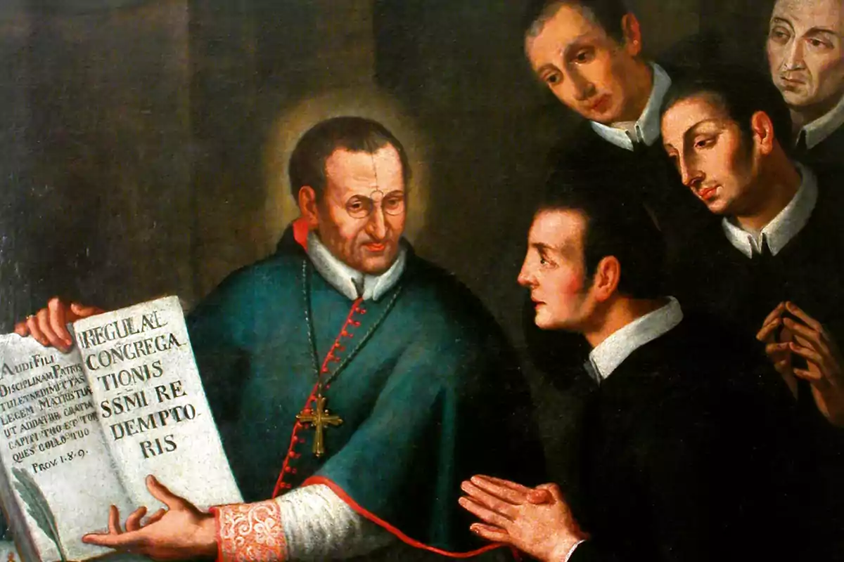 Un home amb vestimenta religiosa mostra un llibre gran a un grup de joves que l'observen amb atenció. Un home amb vestimenta religiosa mostra un llibre gran a un grup de joves que l'observen amb atenció.