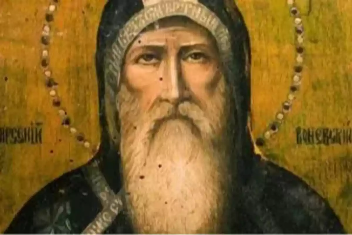 Pintura religiosa de un hombre anciano con barba larga y túnica oscura sobre fondo dorado Pintura religiosa de un hombre anciano con barba larga y túnica oscura sobre fondo dorado