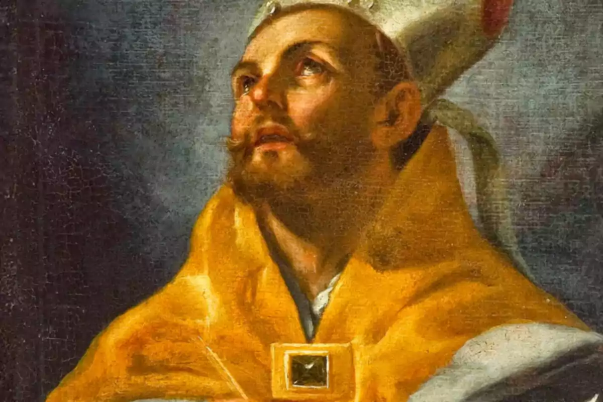 Retrato de un hombre con barba y bigote usando una capa dorada y un sombrero blanco mirando hacia arriba con expresión solemne Retrato de un hombre con barba y bigote usando una capa dorada y un sombrero blanco mirando hacia arriba con expresión solemne