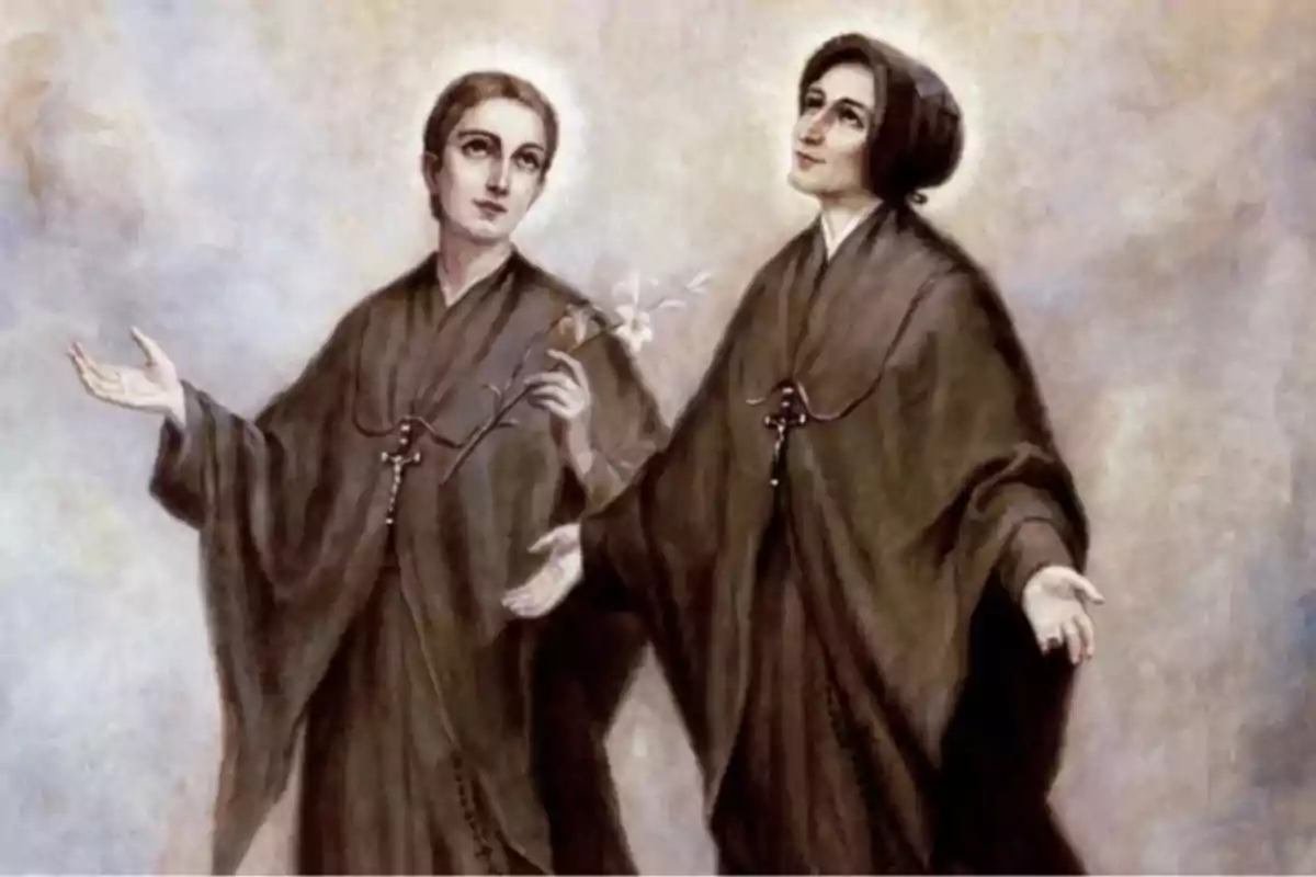 Dos mujeres con vestimenta religiosa de color oscuro y halos en la cabeza una de ellas sostiene un ramo de lirios blancos ambas tienen los brazos extendidos y miran hacia arriba sobre un fondo claro Dos mujeres con vestimenta religiosa de color oscuro y halos en la cabeza una de ellas sostiene un ramo de lirios blancos ambas tienen los brazos extendidos y miran hacia arriba sobre un fondo claro