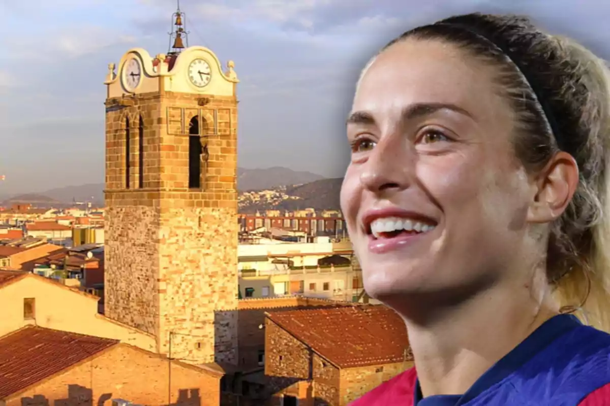 A smiling woman in the foreground with an old clock tower and a city in the background