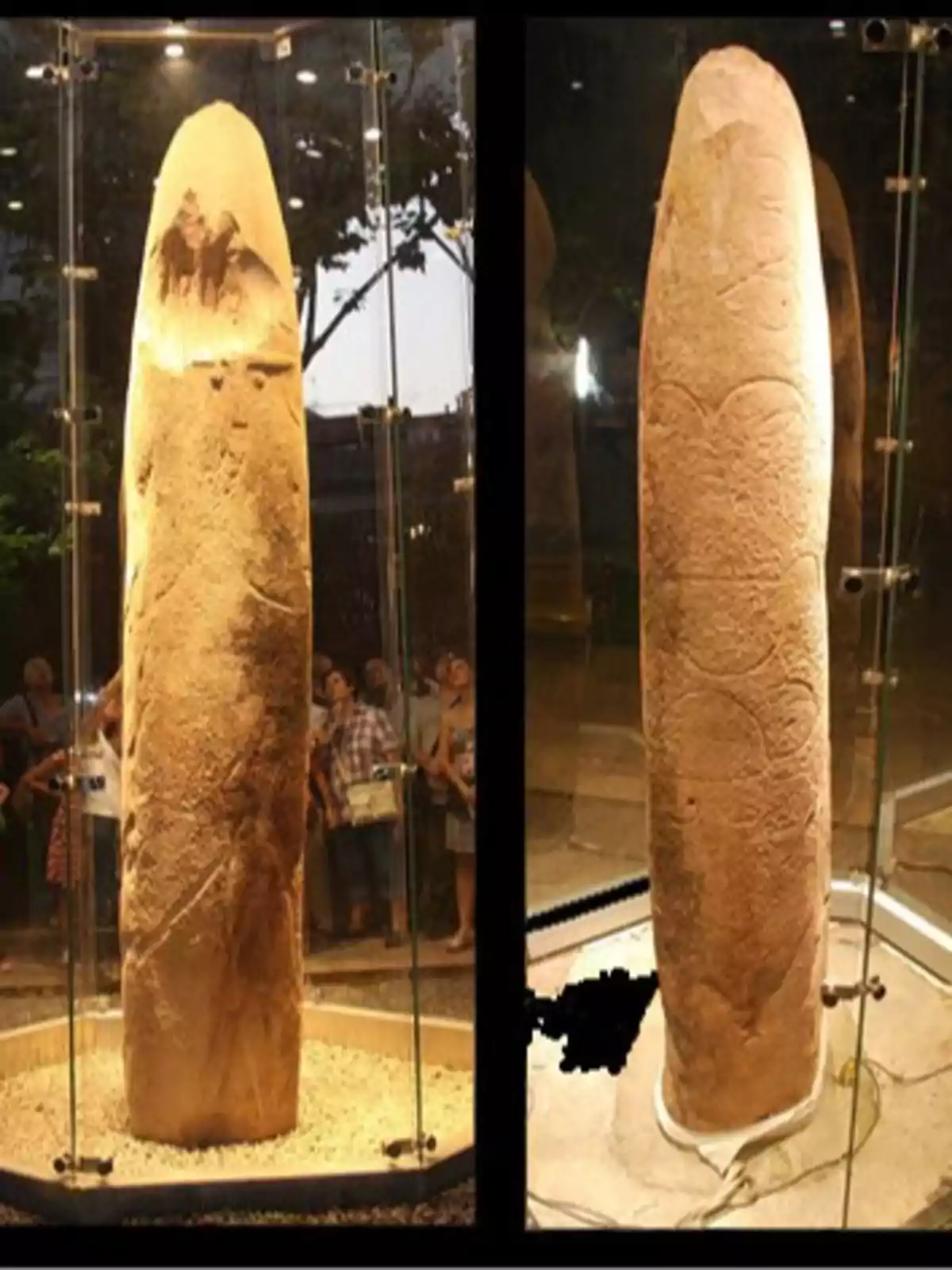 Monòlit de pedra tallada exposat en una vitrina de vidre amb persones observant al voltant Monòlit de pedra tallada exposat en una vitrina de vidre amb persones observant al voltant