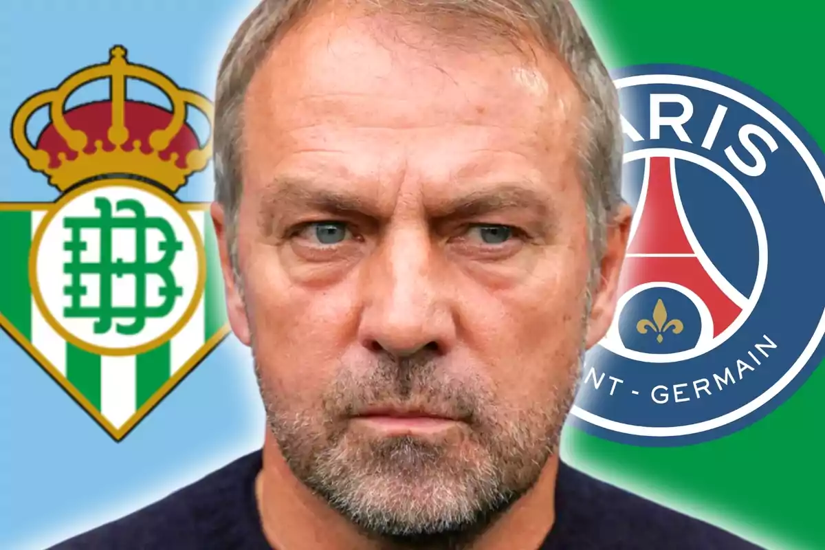 Un hombre de expresión seria en primer plano con los escudos del Real Betis y el Paris Saint-Germain de fondo
