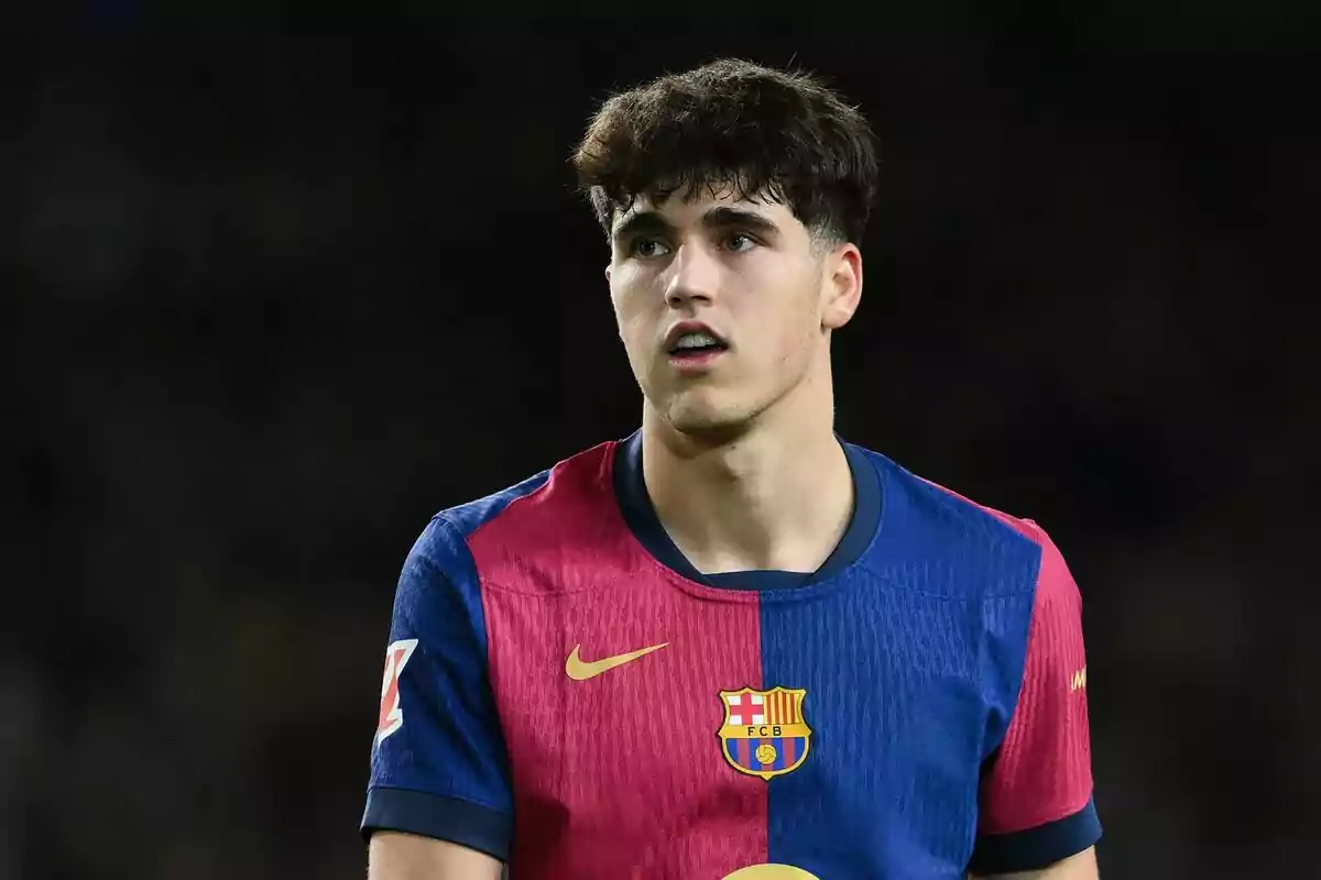 Young player wearing a blue and red FC Barcelona jersey during a match Young player wearing a blue and red FC Barcelona jersey during a match