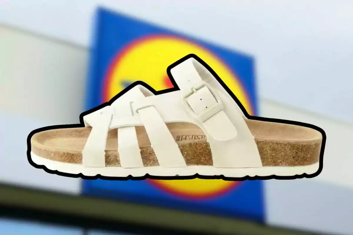 White sandal with cork sole in front of a blurry Lidl store sign White sandal with cork sole in front of a blurry Lidl store sign
