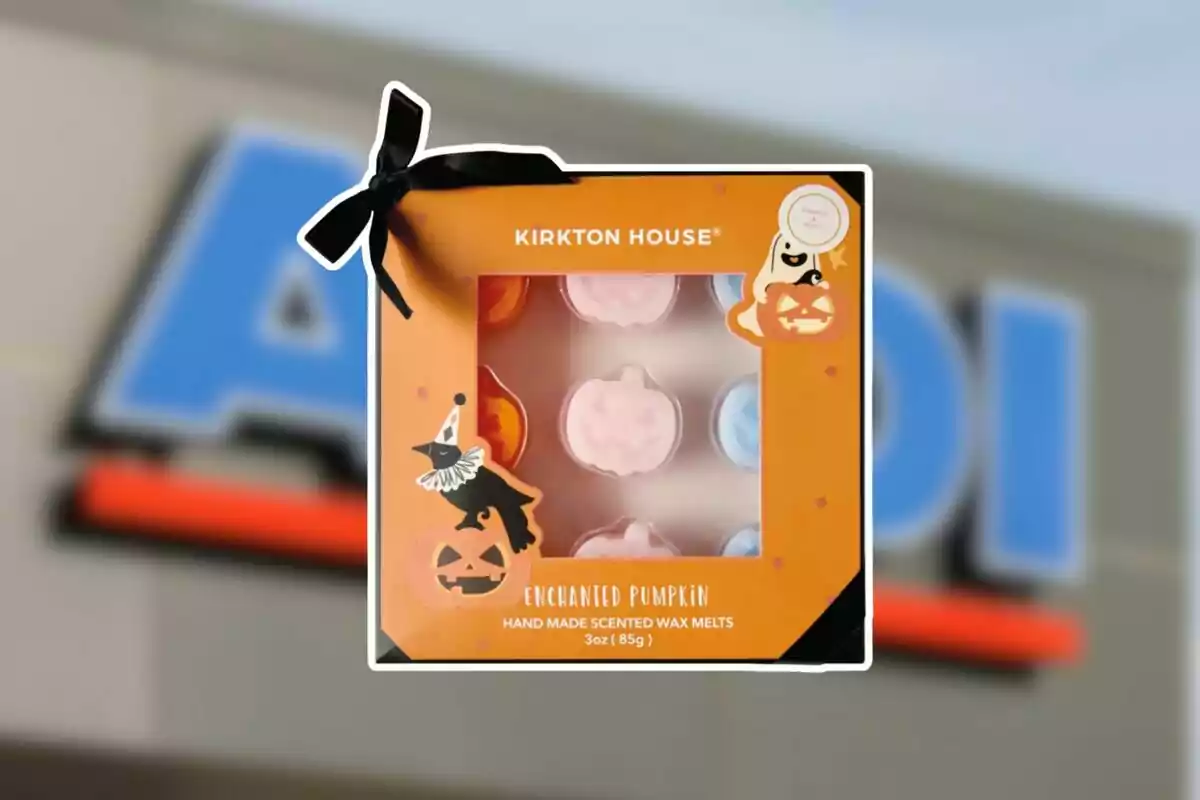 Pumpkin-shaped scented wax box by Kirkton House with a Halloween design and a blurred Aldi store background Pumpkin-shaped scented wax box by Kirkton House with a Halloween design and a blurred Aldi store background
