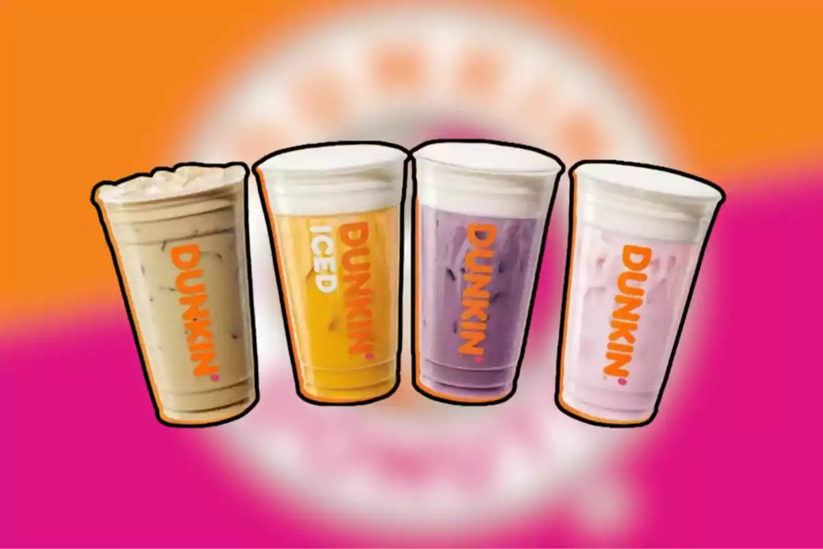 Cuatro vasos de bebidas frías de Dunkin' en diferentes colores sobre un fondo naranja y rosa. Cuatro vasos de bebidas frías de Dunkin' en diferentes colores sobre un fondo naranja y rosa.