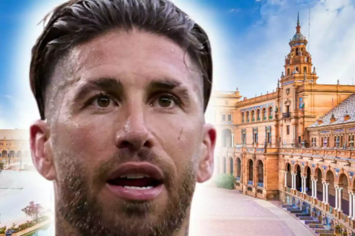 Primer plano de Sergio Ramos con barba y cabello corto frente a un edificio histórico de arquitectura española bajo un cielo azul.
