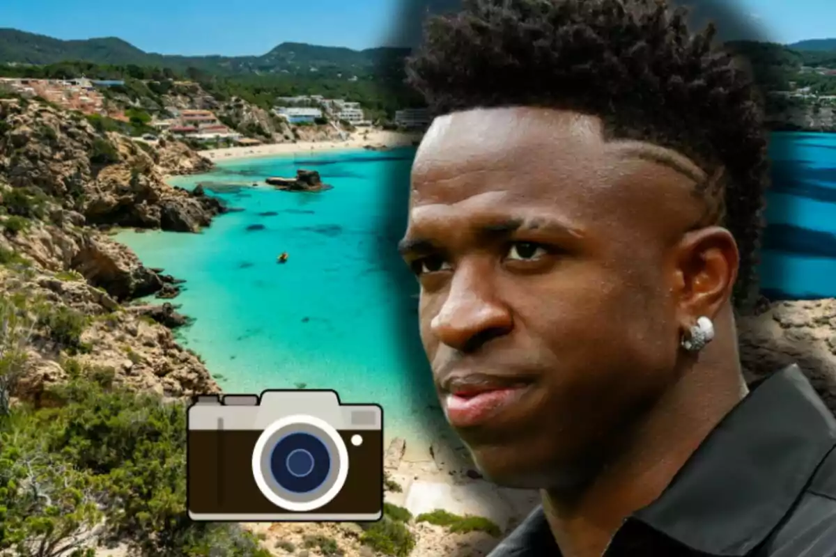 Vinicius with an earring and modern hairstyle in the foreground against a beach background with turquoise water and a camera icon