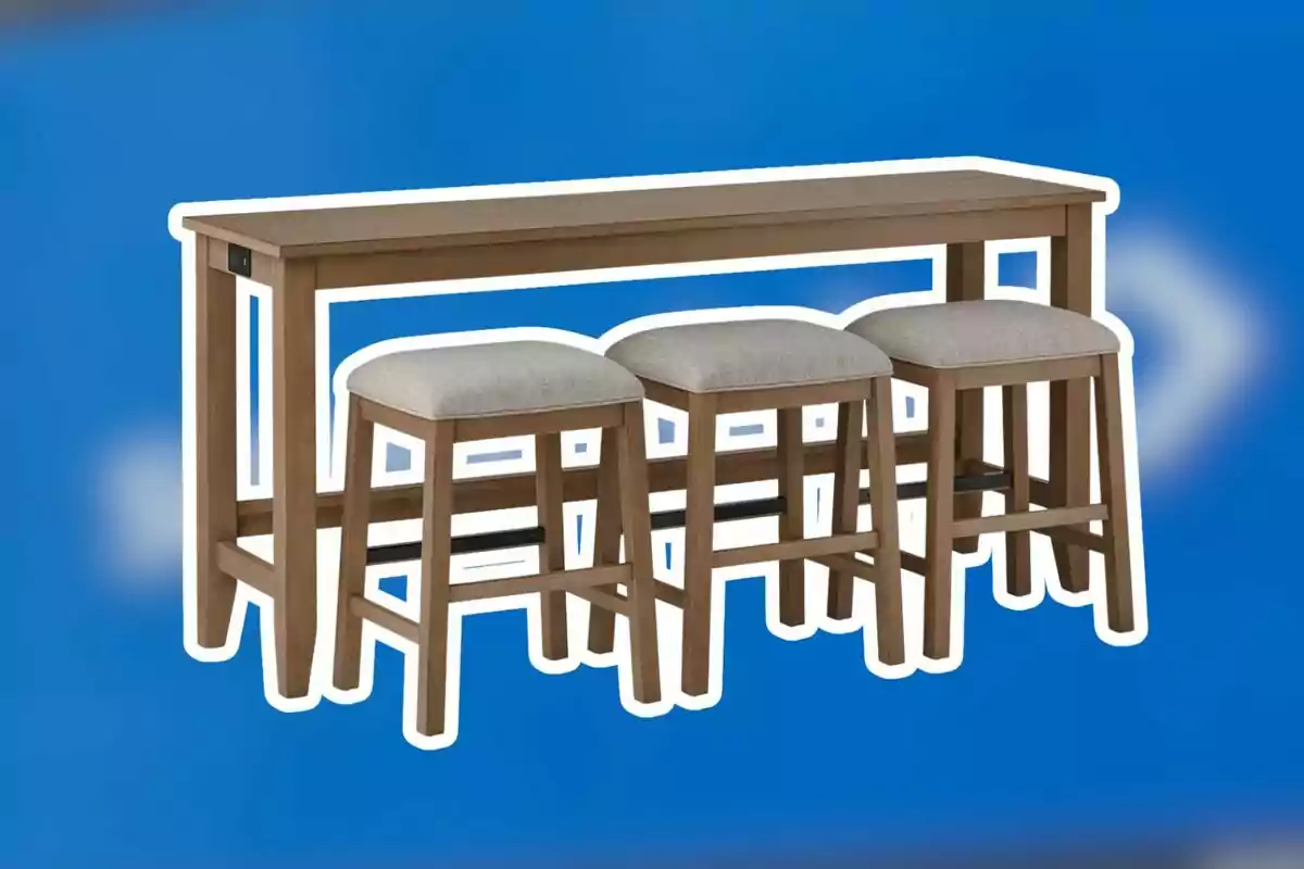Juego de mesa alta de madera con tres bancos tapizados sobre un fondo azul Juego de mesa alta de madera con tres bancos tapizados sobre un fondo azul