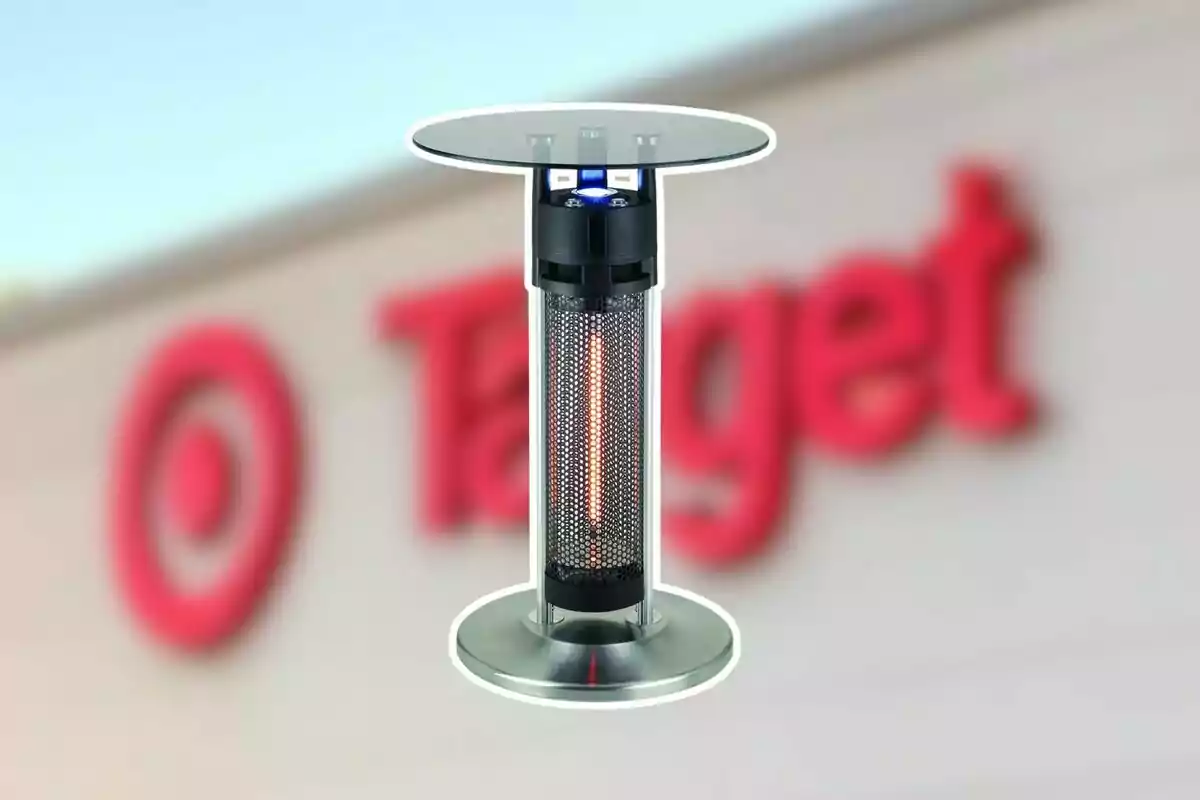 High table with an electric heater in the center and a blurred background of a Target store High table with an electric heater in the center and a blurred background of a Target store