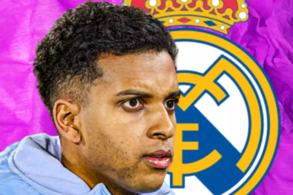 Soccer player in a light blue jacket in the foreground and the Real Madrid crest in the background on a purple backdrop