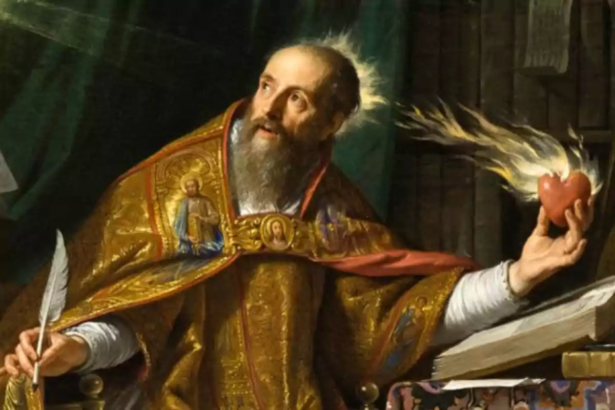 Home amb vestimenta religiosa sosté un cor en flames mentre escriu amb una ploma al costat d’un llibre obert Home amb vestimenta religiosa sosté un cor en flames mentre escriu amb una ploma al costat d’un llibre obert