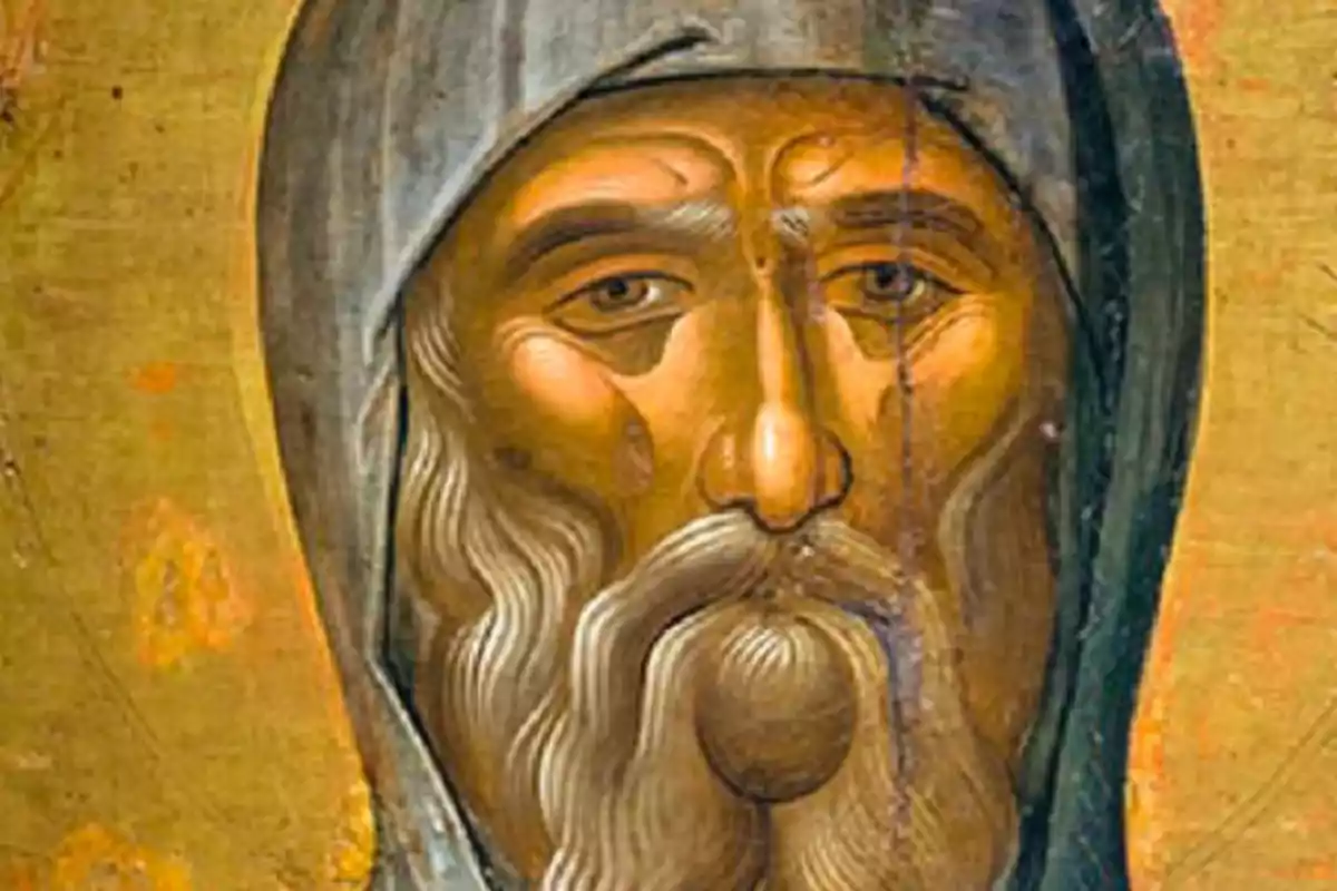 Icona religiosa amb el rostre d’un home amb barba i túnica grisa sobre fons daurat Icona religiosa amb el rostre d’un home amb barba i túnica grisa sobre fons daurat