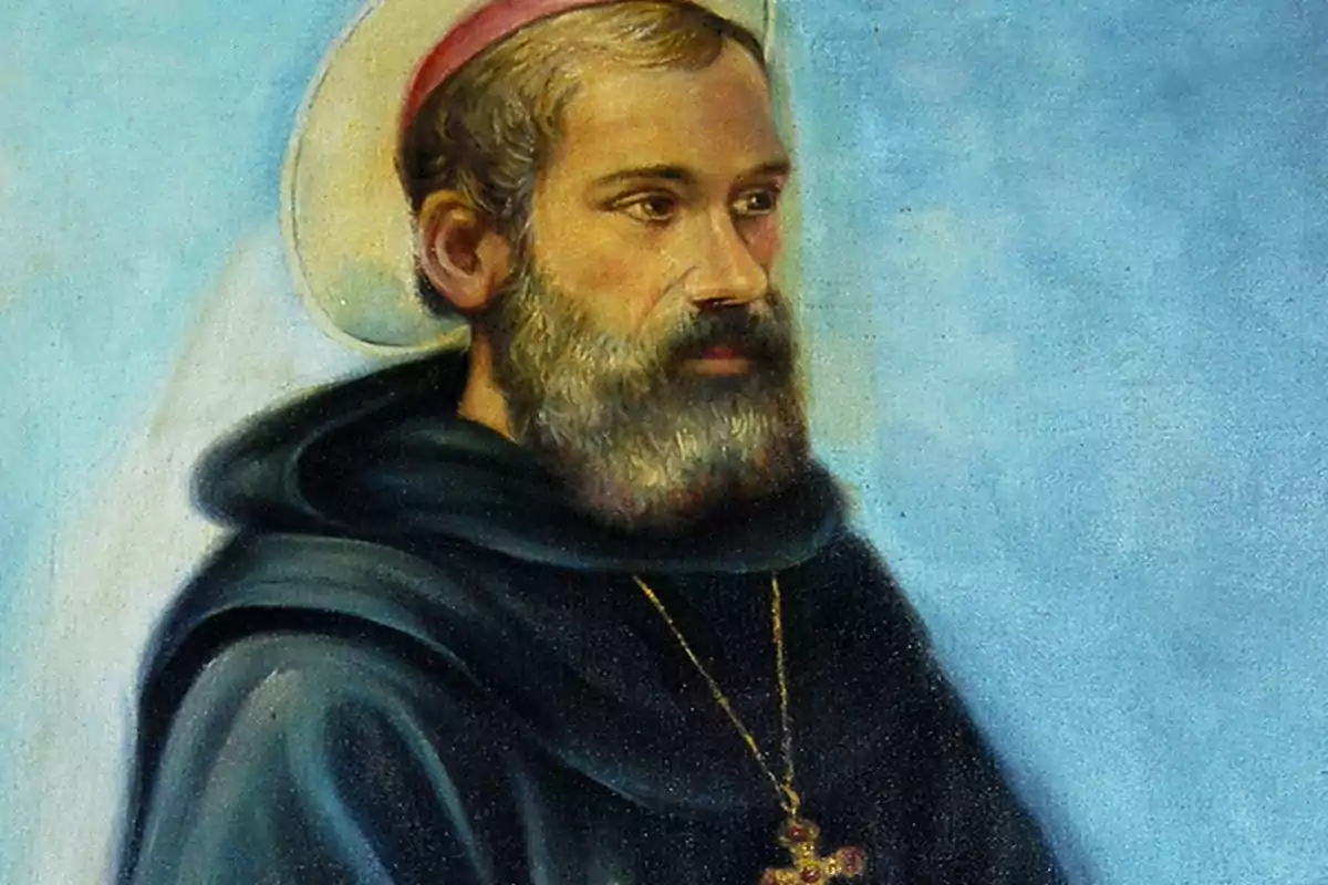 Pintura d’un home amb barba i túnica fosca que porta un halo i un collaret amb creu sobre fons blau Pintura d’un home amb barba i túnica fosca que porta un halo i un collaret amb creu sobre fons blau