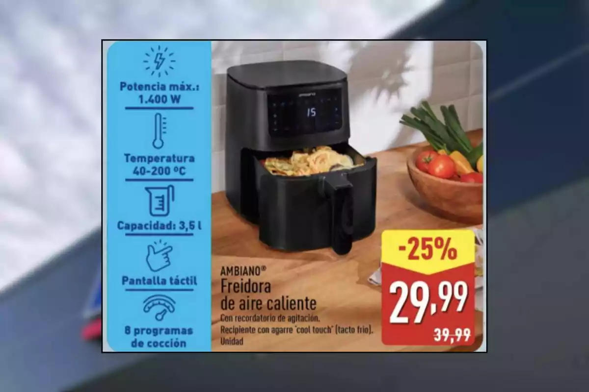 Freidora de aire caliente negra con pantalla táctil sobre una mesa de cocina junto a un tazón de verduras y un cartel de oferta que muestra un descuento del 25 por ciento y el precio de 29,99 euros Freidora de aire caliente negra con pantalla táctil sobre una mesa de cocina junto a un tazón de verduras y un cartel de oferta que muestra un descuento del 25 por ciento y el precio de 29,99 euros