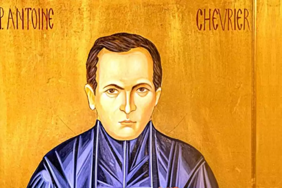 Pintura religiosa d’un home amb cabells foscos i vestimenta blava sobre un fons daurat amb lletres vermelles a la part superior