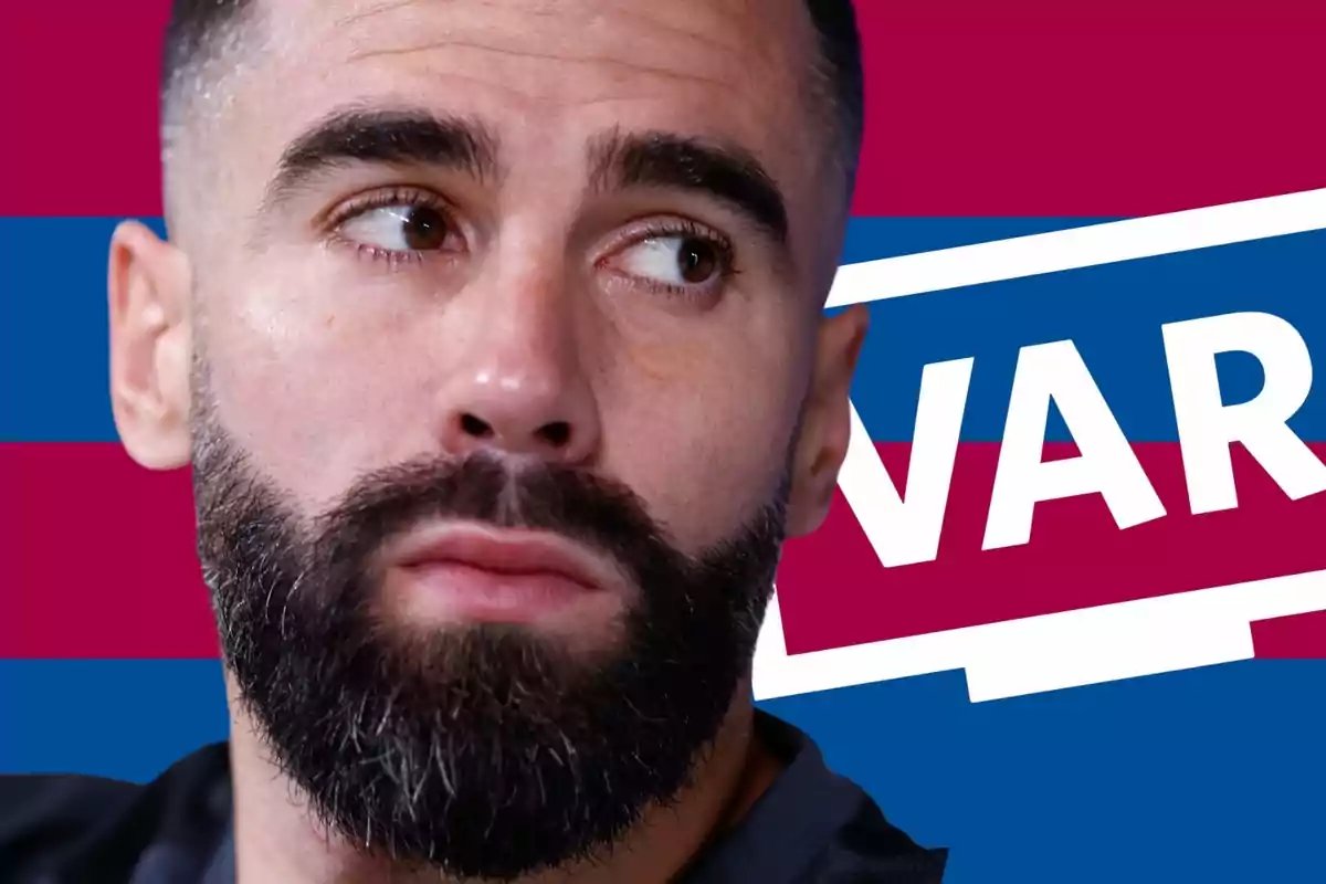Close-up of a bearded man looking to the side with a background of blue and maroon stripes and the word VAR in large letters