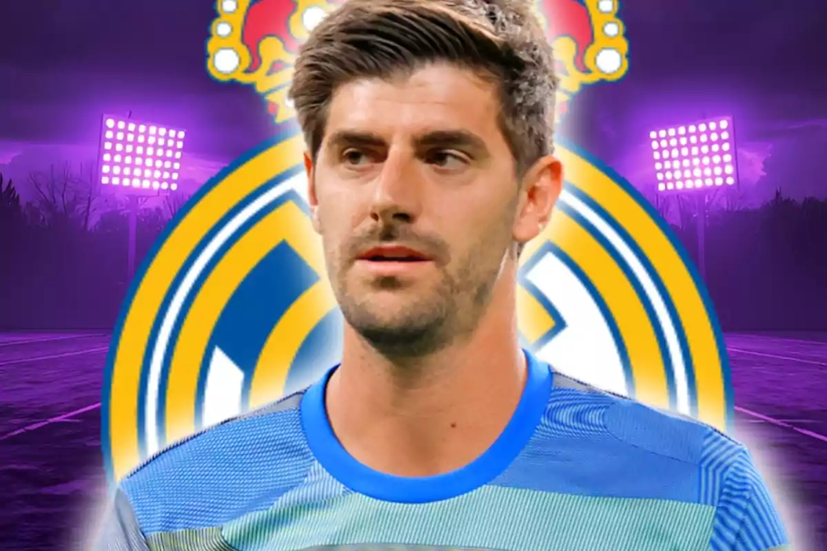Soccer goalkeeper wearing a blue jersey in front of the Real Madrid crest with stadium lights in the background