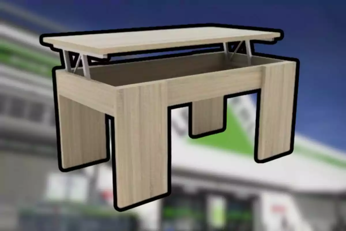 Taula de fusta clara amb tapa elevable i espai d’emmagatzematge interior sobre un fons desenfocat Taula de fusta clara amb tapa elevable i espai d’emmagatzematge interior sobre un fons desenfocat