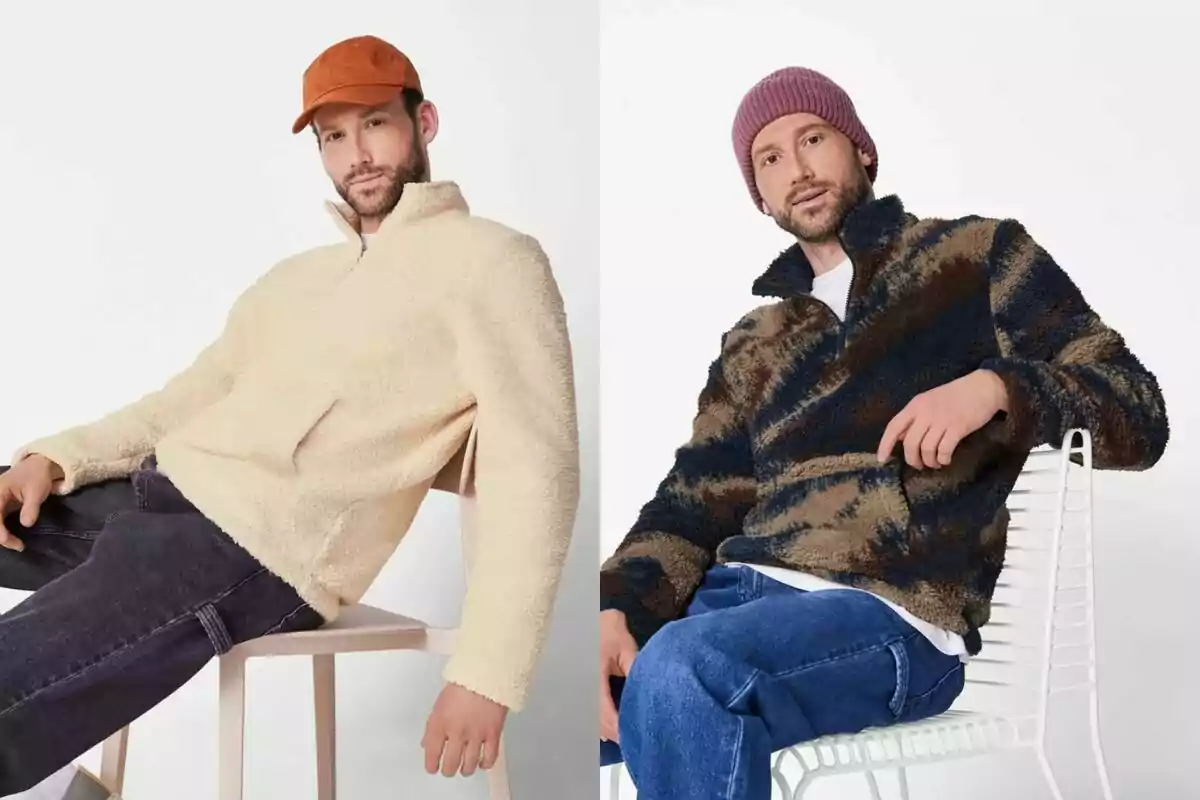 Two men pose sitting down wearing sherpa sweaters, one in beige with an orange cap and the other with a dark-patterned sweater and a pink knit beanie. Two men pose sitting down wearing sherpa sweaters, one in beige with an orange cap and the other with a dark-patterned sweater and a pink knit beanie.