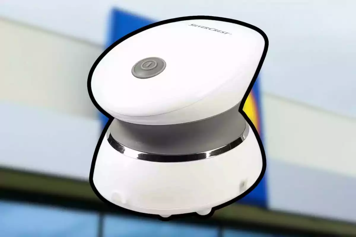 White electric massager with gray and silver details on a blurred background White electric massager with gray and silver details on a blurred background