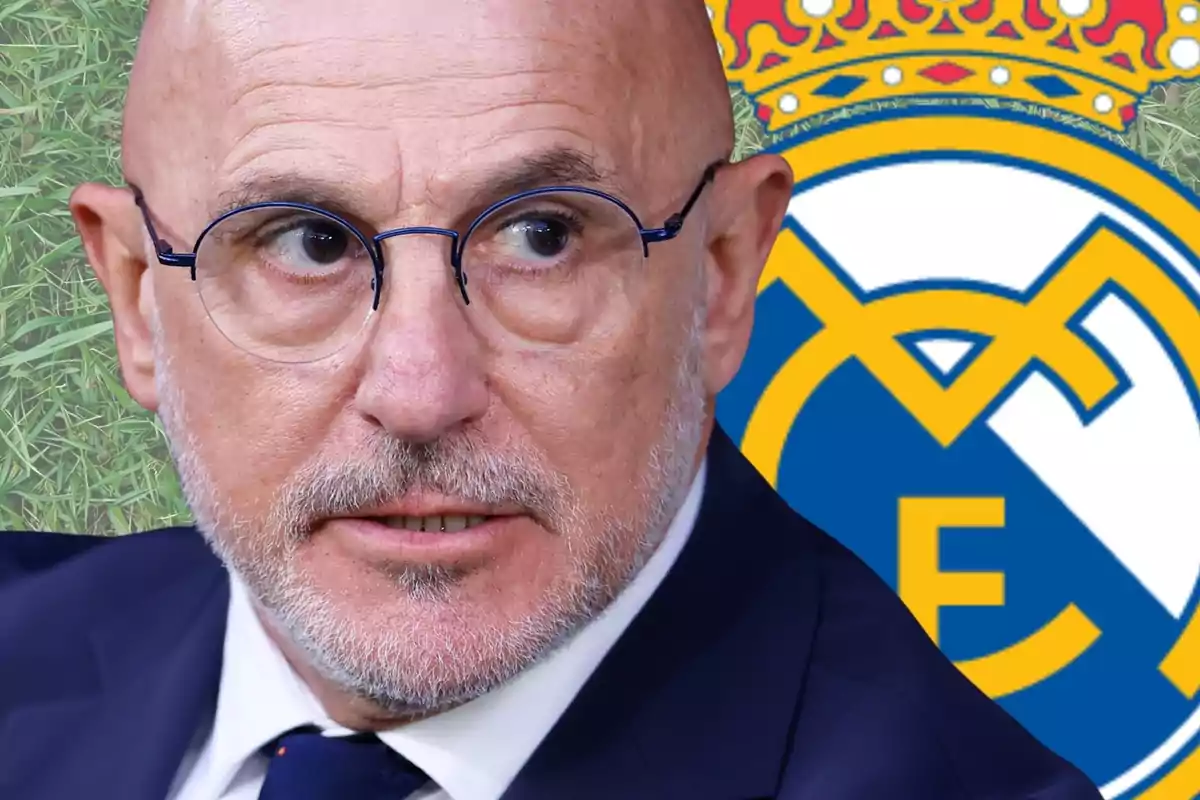 Bald man with glasses and a beard looking to the side with the Real Madrid crest in the background
