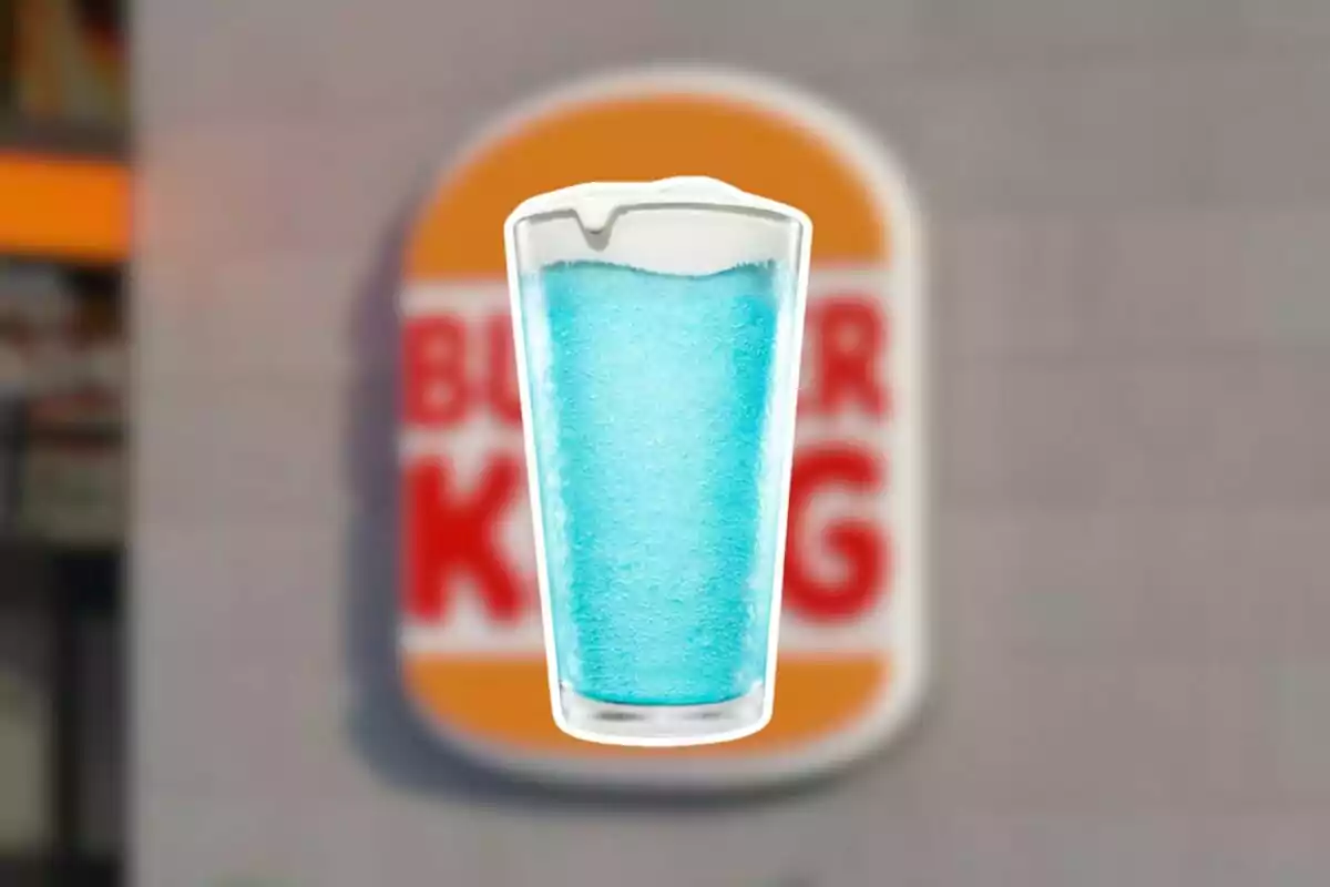 Blue frappé-style drink cup in front of a blurry Burger King sign Blue frappé-style drink cup in front of a blurry Burger King sign