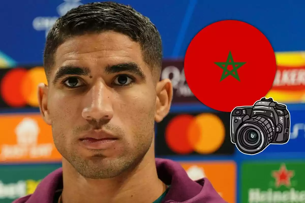 Achraf Hakimi looks ahead with a serious expression; in the background, there are brand logos and a red circle with a green star representing the flag of Morocco next to a drawing of a camera.