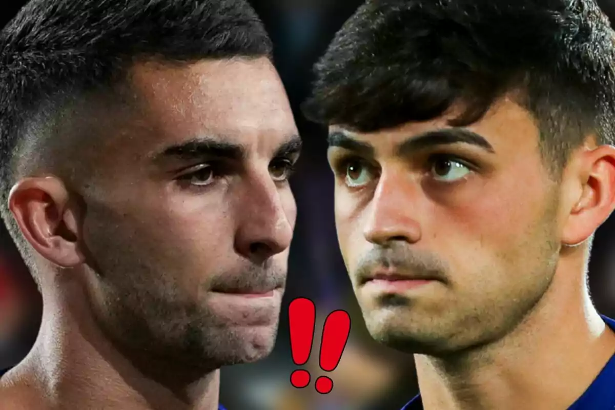 Ferran Torres i Pedri mirant-se fixament amb expressions serioses i dos signes d’exclamació vermells entre ells