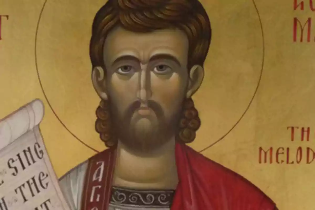 Pintura religiosa de estilo bizantino que muestra a un hombre con barba y cabello rizado, vestido con túnica roja y fondo dorado, sosteniendo un pergamino con letras en inglés