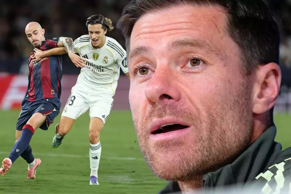 Un jugador del Reial Madrid disputa la pilota amb un rival mentre en primer pla apareix el rostre d’un home que observa l’escena amb atenció.