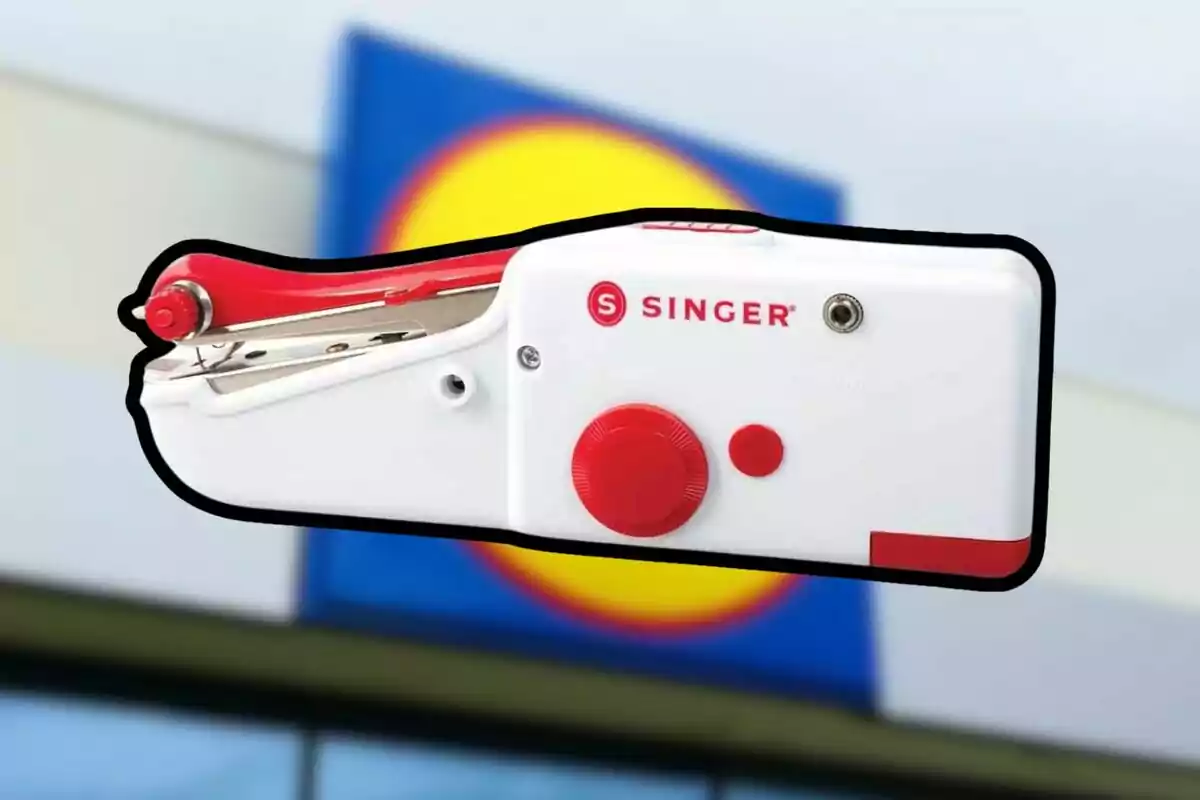 Singer portable sewing machine in the foreground with a blurred background of a blue and yellow sign