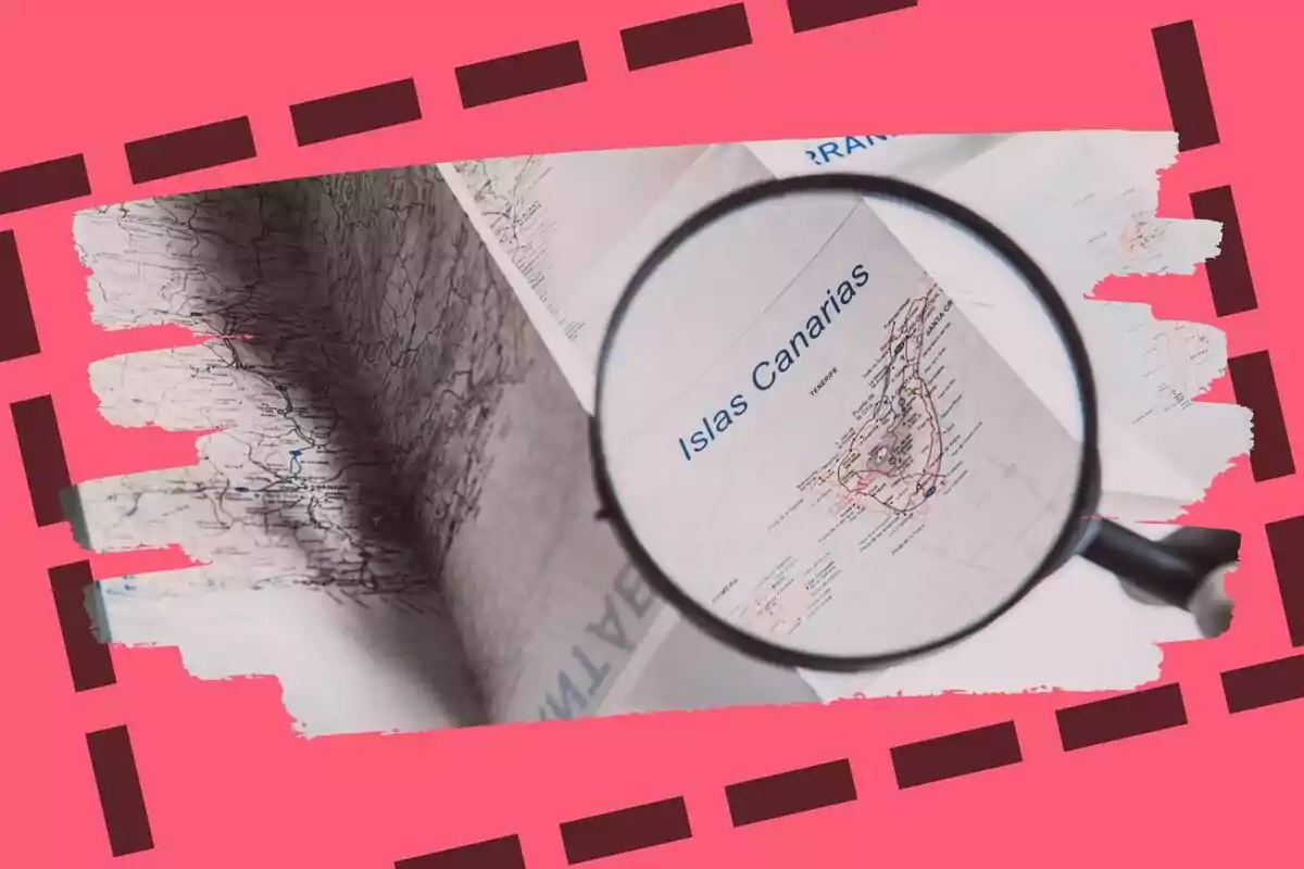 Mapa de las Islas Canarias visto a través de una lupa sobre un fondo rosa decorativo