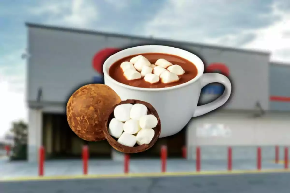 Hot chocolate mug with marshmallows and a chocolate bomb filled with marshmallows in front of a blurred Costco store.