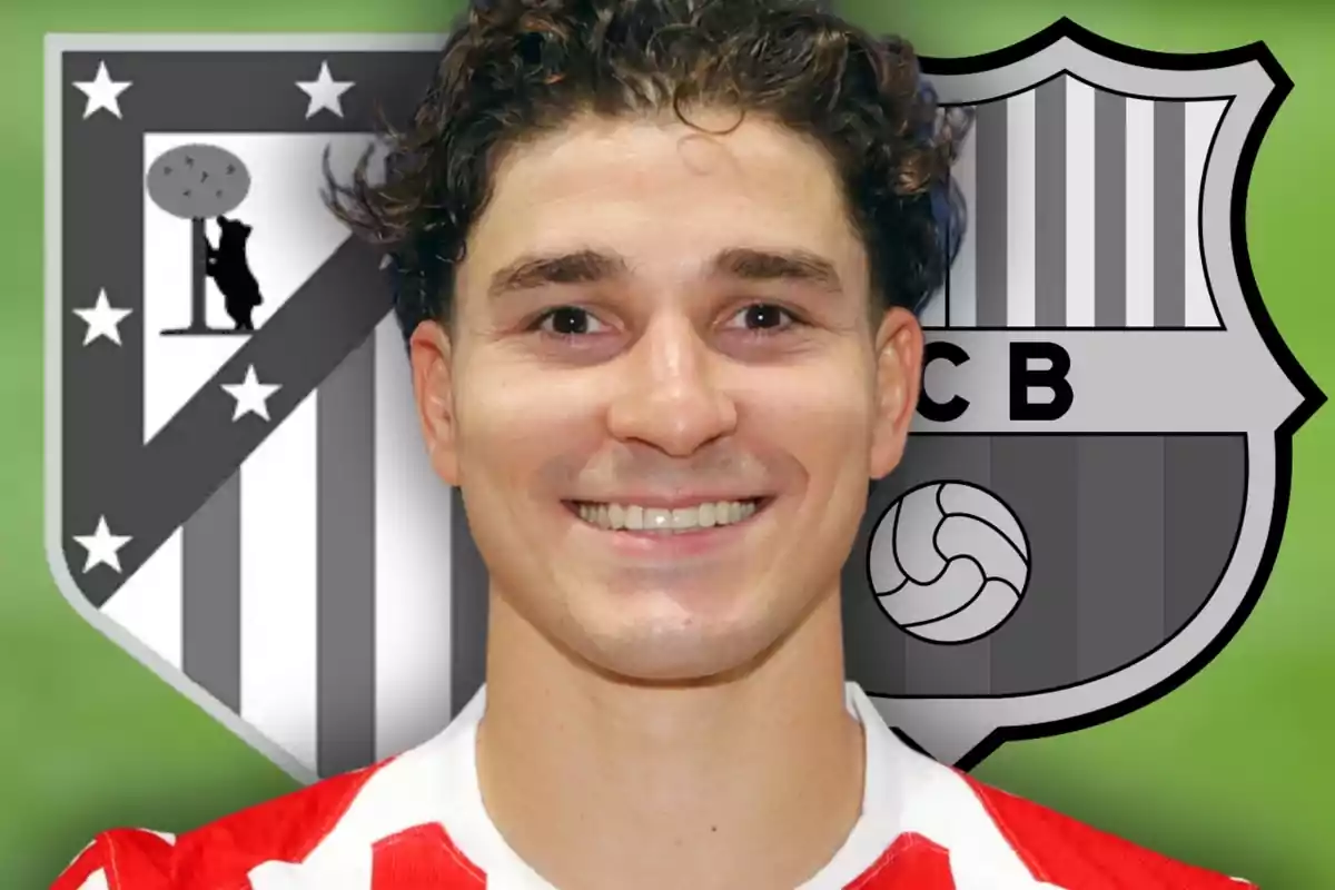 A smiling man wearing a red and white striped jersey in front of the black and white crests of Atlético de Madrid and Barcelona